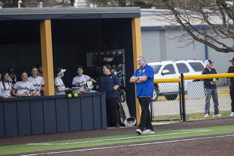 First year Newman softball coach Charlie Woodward works at third Tuesday, March 18, 2025, against Sterling.