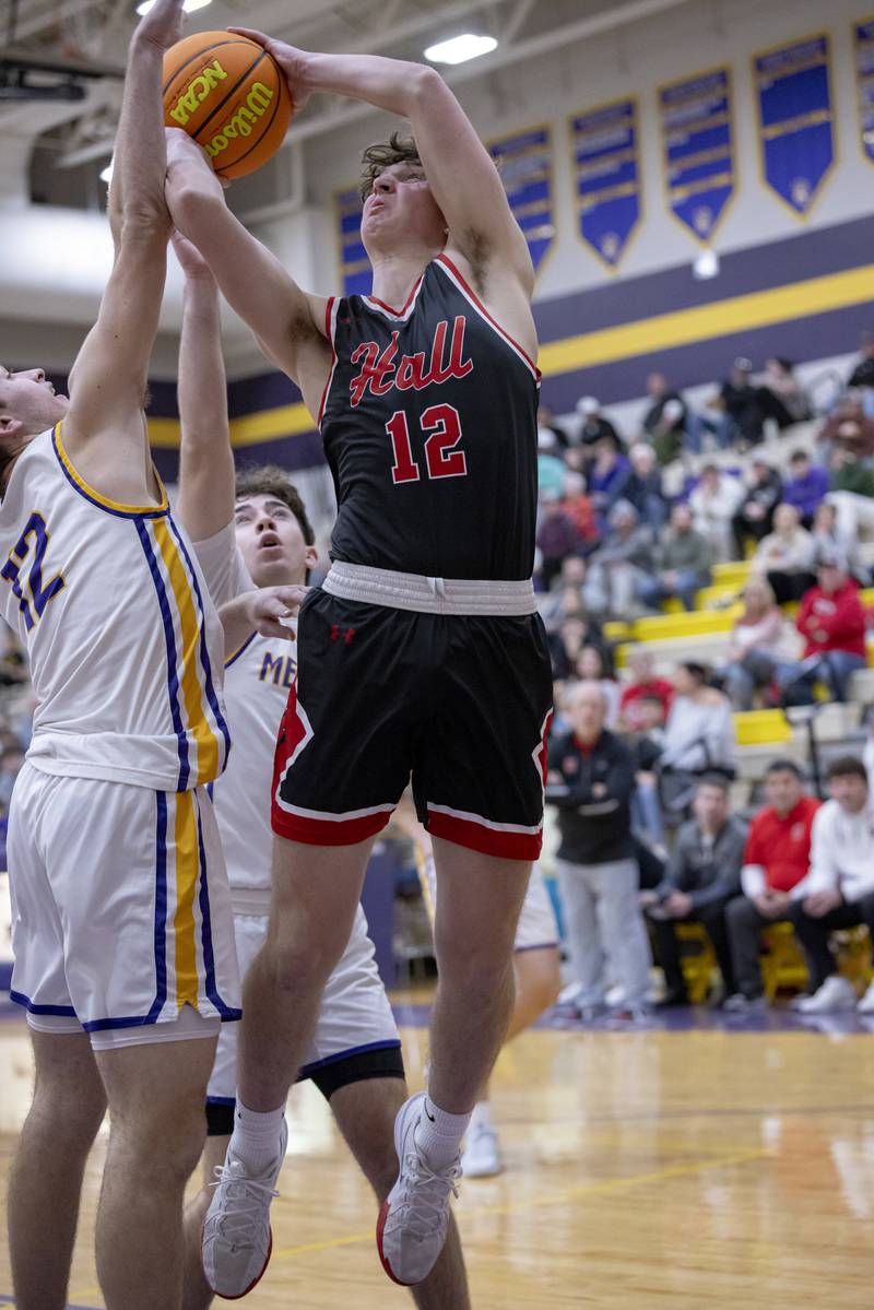 Jack Jablonski of Hall High School gets a shot off through Mendota's defense  during the game on January 24, 2025 at Mendota High School.