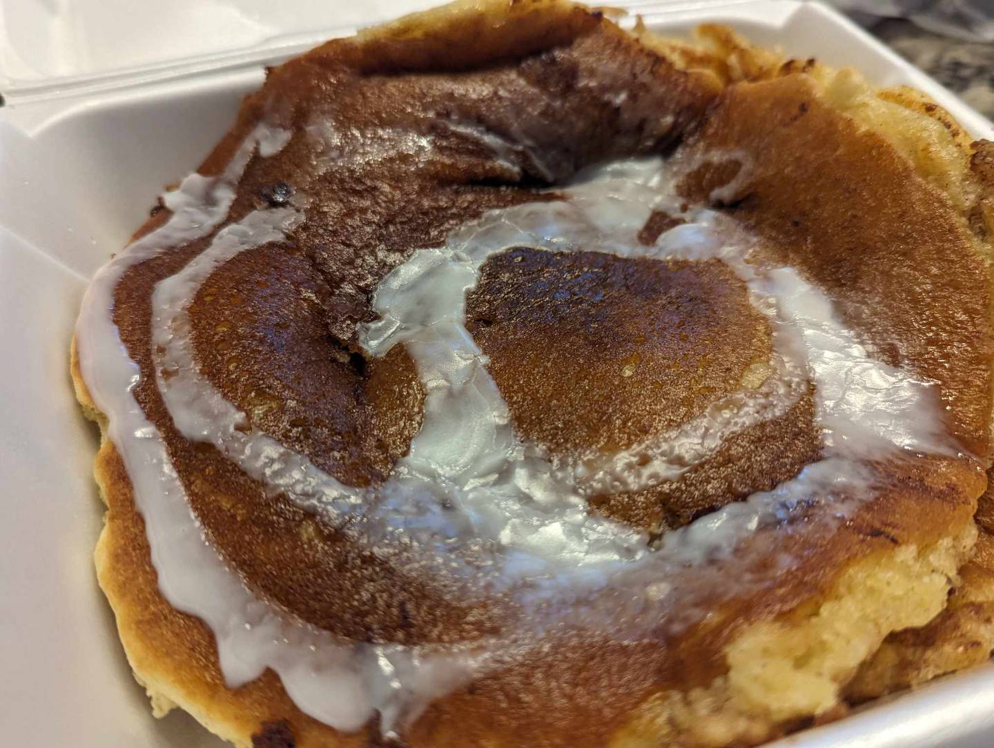 The cinnamon swirl pancakes at the southern Cafe in Crest Hill was “a delicious swirl of cinnamon butter-infused pancakes” topped with cream cheese icing, the menu said.