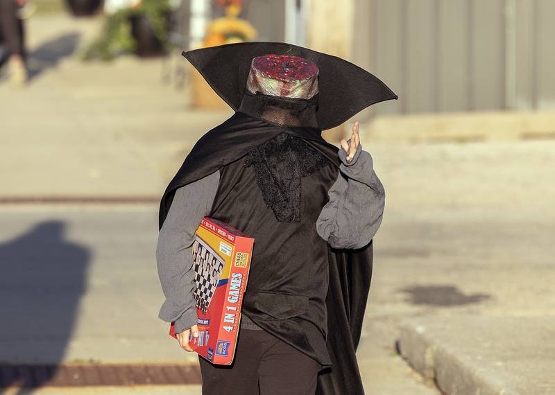 No heads are better than one according to Lyric Livingston, 6, of Rock Falls Friday, Oct. 25, 2024. Hundreds of costumed characters hit the downtown in Rock Falls for the annual Biz Boo Trick or Treat event.