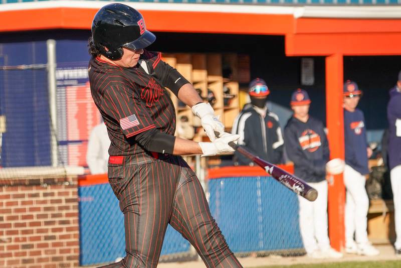 Benet’s Jonathon Rossi (18) doubles against Oswego during a baseball game at Oswego High School on Tuesday, March 25, 2025.