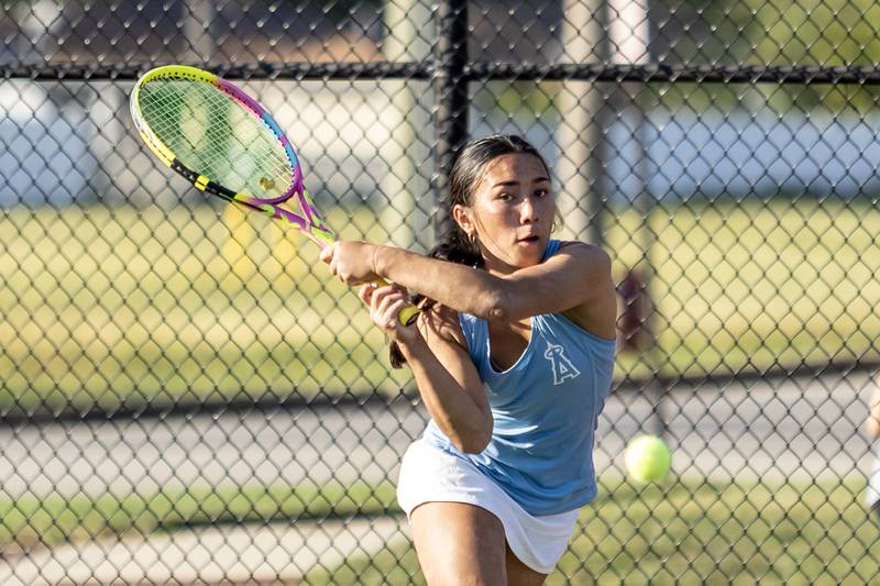 Joliet Catholic Academy’s Giuliana Espino competes in varsity singles tennis during a match against Joliet Township at Joliet West on Sept. 29, 2025.