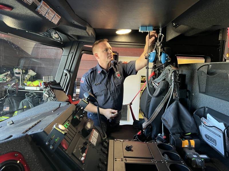DeKalb Fire Department Lieutenant Bill Lynch installs equipment into Station Three's new Engine Three on Oct. 3, 2022.