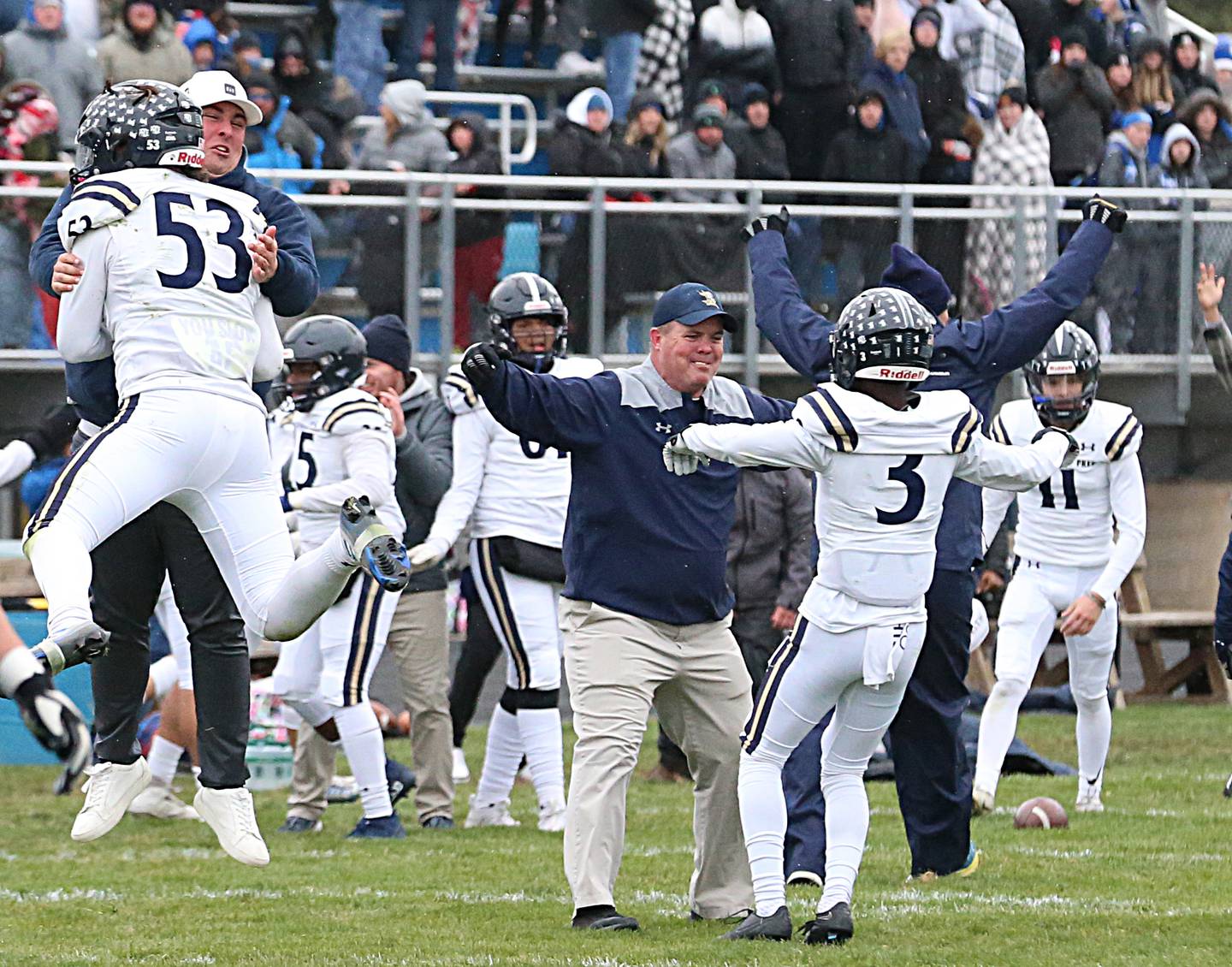 IC Catholic's Michael Calcagno (53) and Kaleb Ellis (3) celebrate after defeating Princeton in the Class 3A Quarterfinal game on Saturday, Nov. 12, 2022 in Princeton.