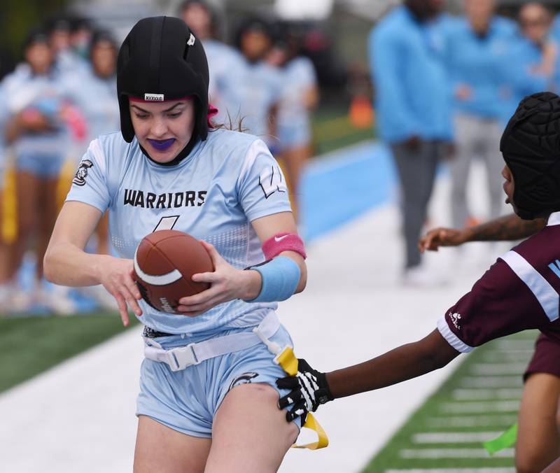 Willowbrook quarterback Marli Smrz carries the ball for a touchdown during the second quarter of the third-place game of the girls flag football state tournament against Chicago Perspectives on Saturday, Oct. 18, 2025 in Villa Park.
