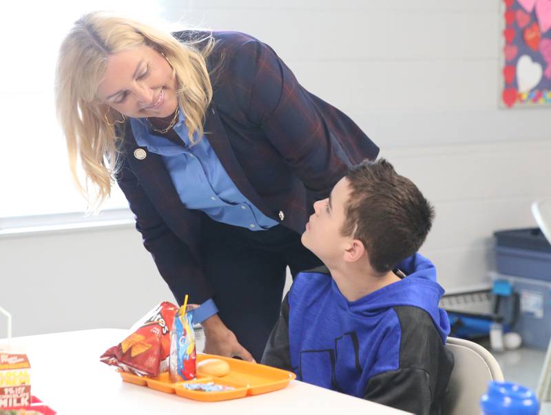 State Sen. Sue Rezin (R-Morris) talks to a student during lunch at the current Lighted Way building on Monday, Jan. 23, 2023 in La Salle. Lighted Way will be moving this summer from their 10,000-square-foot center to a 33,000-square-foot center and will allow better programming and more activities.
