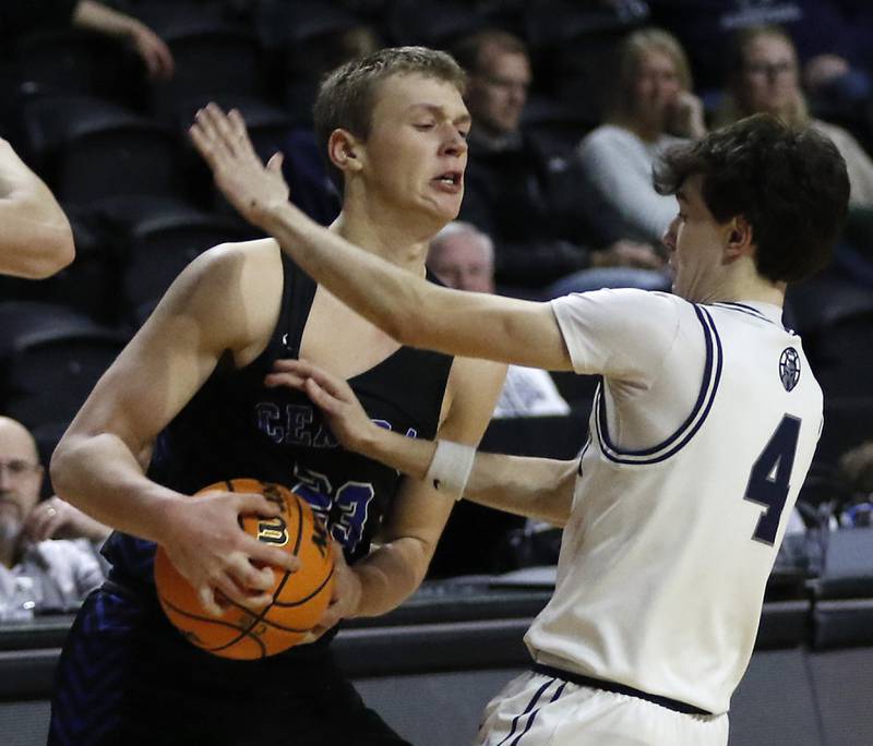 Burlington Central's Jacob Johnson this to protect the basketball as he is guarded by Cary-Grove's Dylan Dumele during a Fox Valley Conference basketball game  on Tuesday, Jan. 14, 2025, at Now Arena in Hoffman Estates.