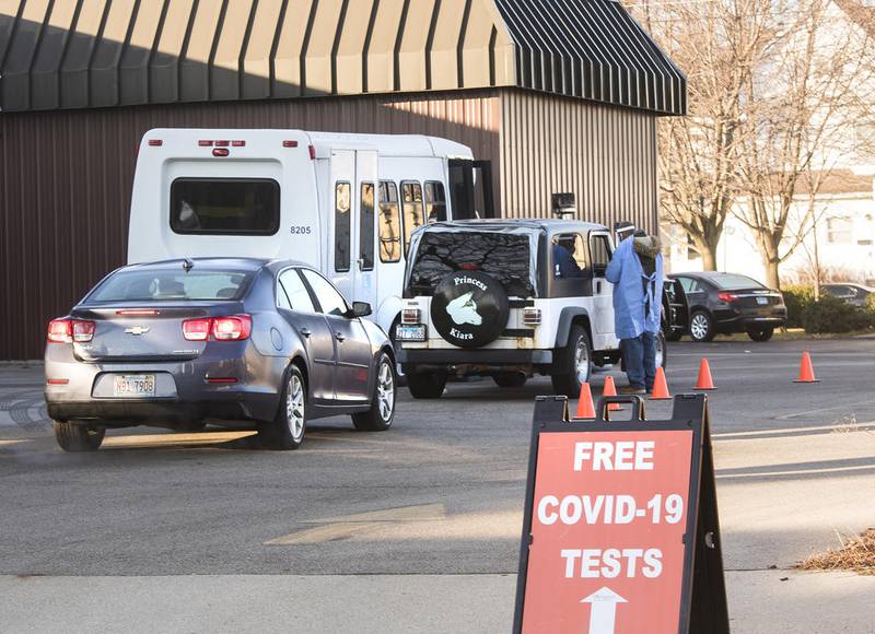 Vehicles line up for free COVID-19 tests Thursday outside the Ogle County Health Department in Rochelle.