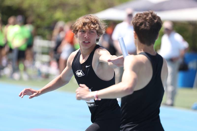 Plainfield South’s Gavin Borger takes the baton in the Class 3A 4x800 Relay State Finals on Saturday, May 27, 2023 in Charleston.