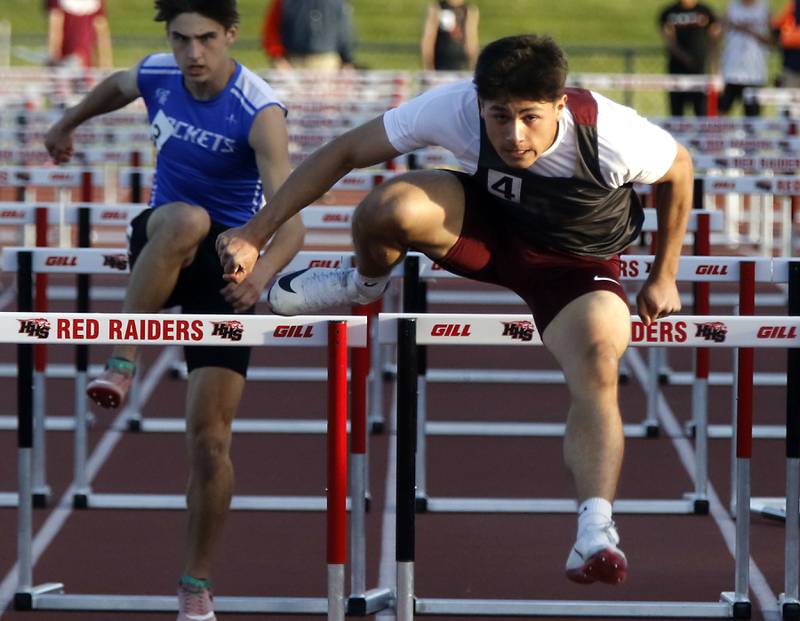 Prairie Ridge's Alexander Trejo flies over a hurdle on his way to winning the 110 meter high hurdles during the Fox Valley Conference  Boys Track and Field Meet on Thursday, May 14, 2026, at Huntley High School.