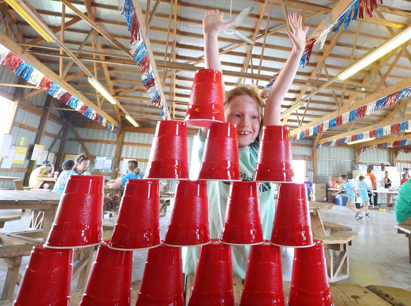 Annie Hall of Henry, reacts after stacking cups during a "Minute to Win it" competition during the Marshall-Putnam 4-H Fair on Tuesday, July 23, 2024 at the Marshall-Putnam Fairgrounds in Henry.