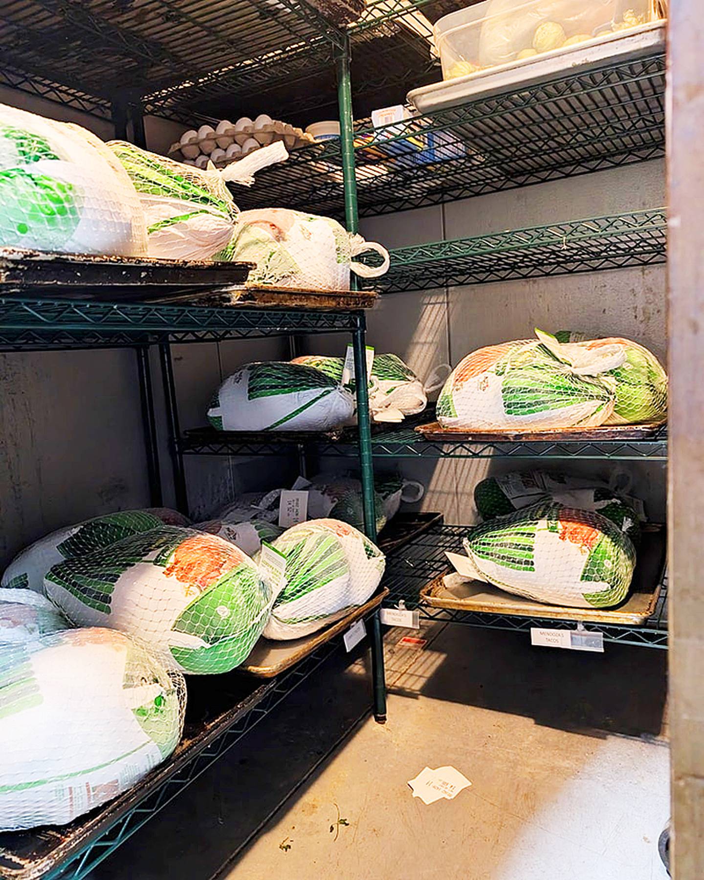 Turkeys await preparation to be given to needy families, through the charitable efforts of Devon Nicklaus and Emily Juist of Rock Falls.