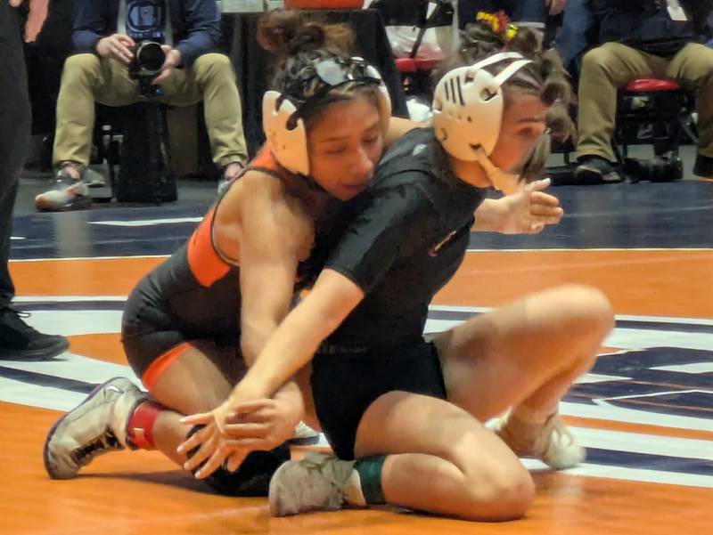 Larisza Gomez-Guevara reacts after giving up a two-point nearfall at the third-period buzzer of a 10-8 loss of the third-place match at the IHSA Girls Wrestling State Championship on Saturday in Bloomington.