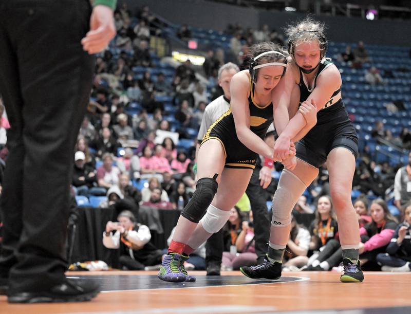 Glenbard North’s Keagan Edwards, left, wrestles Bartlett’s Lilly White in the 130-pound class at the girls wrestling state finals tournament at Grossinger Arena in Bloomington on Saturday, Feb. 28, 2026.