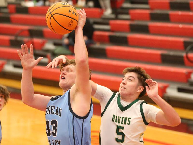 Bureau Valley's Elijah Endress is fouled by St. Bede's Halden Hueneburg during the 50th annual Colmone Classic on Thursday, Dec. 12, 2024 at Hall High School.