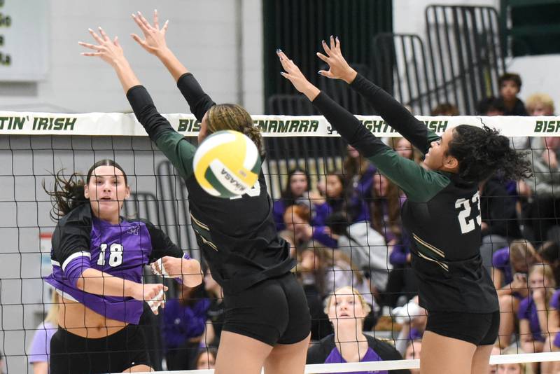 Manteno's Maddie Gesky, left, watches her kill attempt sail past the Bishop McNamara block during a game at Bishop McNamara Monday, Oct. 20, 2025.