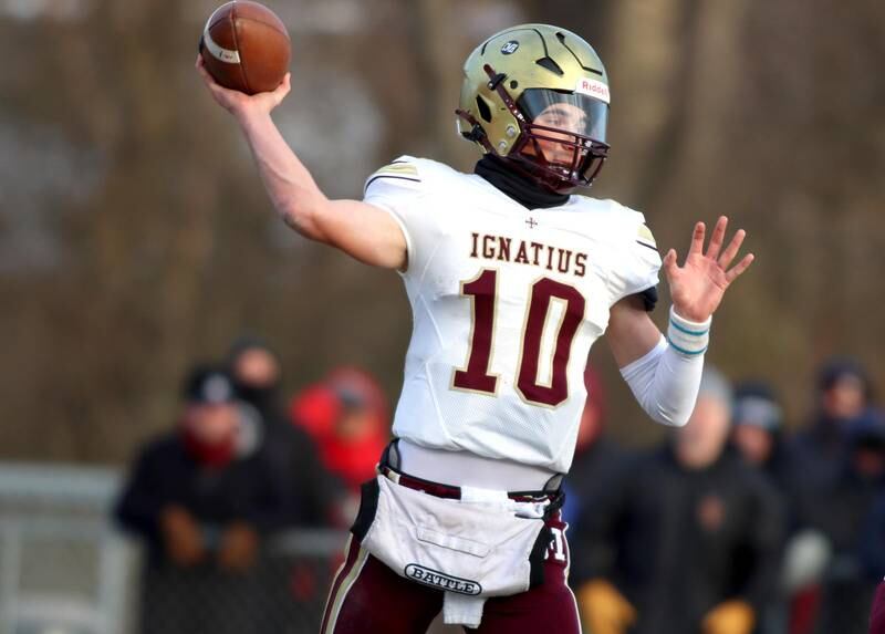 St. Ignatius’ Jake Petrow passes in Class 6A football playoff semifinal action at Crystal Lake on Saturday.