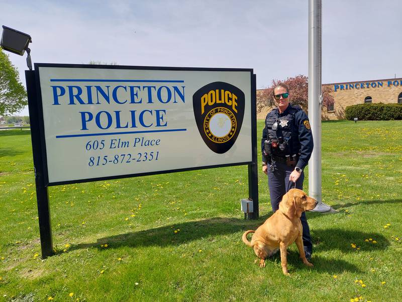 Princeton police officer Sara Rokey poses with her bloodhound and K9 officer Lucy.