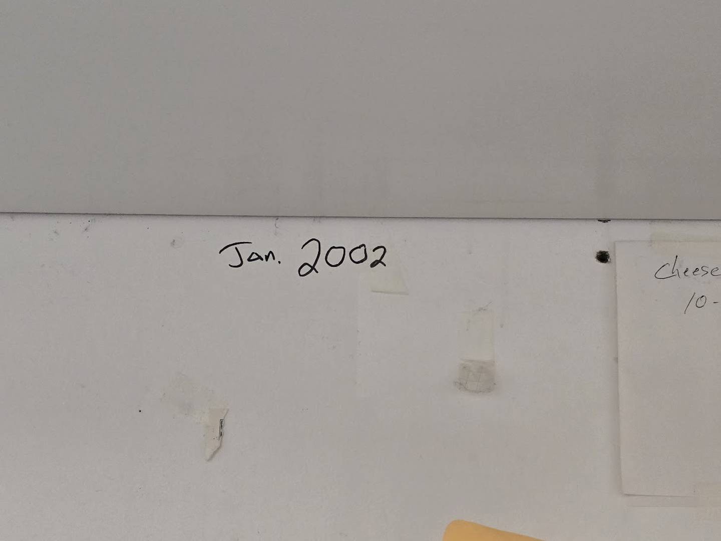 Tim Reilly, owner of Babe's Hot Dogs in Joliet, points out the wall in his office where he wrote the date he opened in his current location on Tuesday, Dec. 9, 2025. Reilly has listed his business, which many consider a staple in the community, for sale.