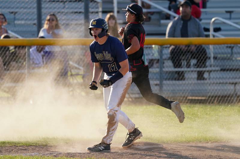 Neuqua Valley's Mike Langan (17) reacts after scoring on a Yorkville wild pitch during a Class 4A Neuqua Valley Regional semifinal baseball game at Neuqua Valley High School in Naperville on Thursday, May 23, 2024.