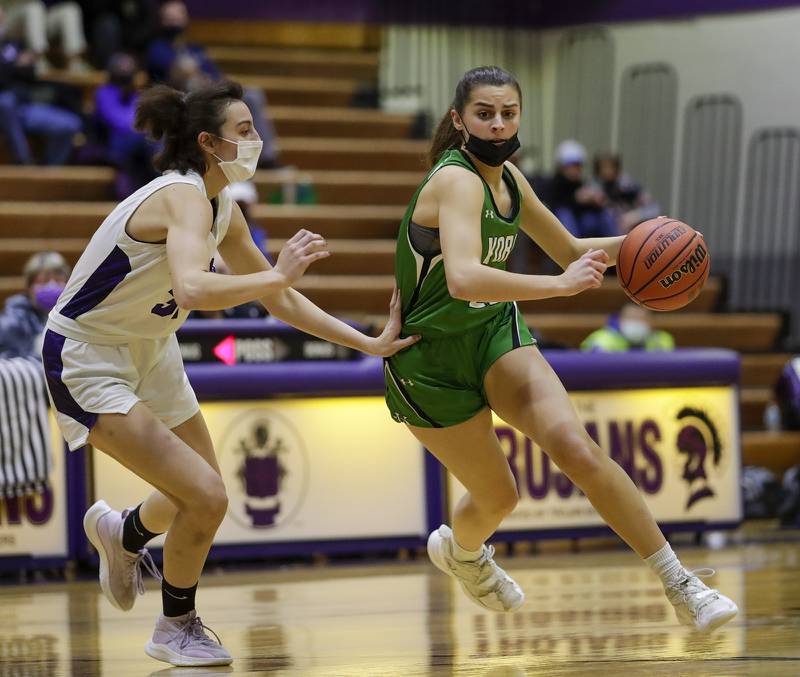 York's Stella Kohl drives to the net against Downers Grove NorthÕs Eleanor Harris during a game in Downers Grove on Wednesday, Dec. 8, 2021.