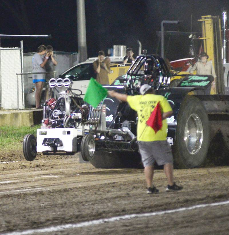 Logan Dornbush of Albany starts Time Bandit, 2021 modified entry, in the 650 open division of the Illini Truck & Tractor Pulls at the Ogle County Fair on Thursday, Aug. 1, 2024. He won the class with a pull of 310 feet in 27.6 seconds.