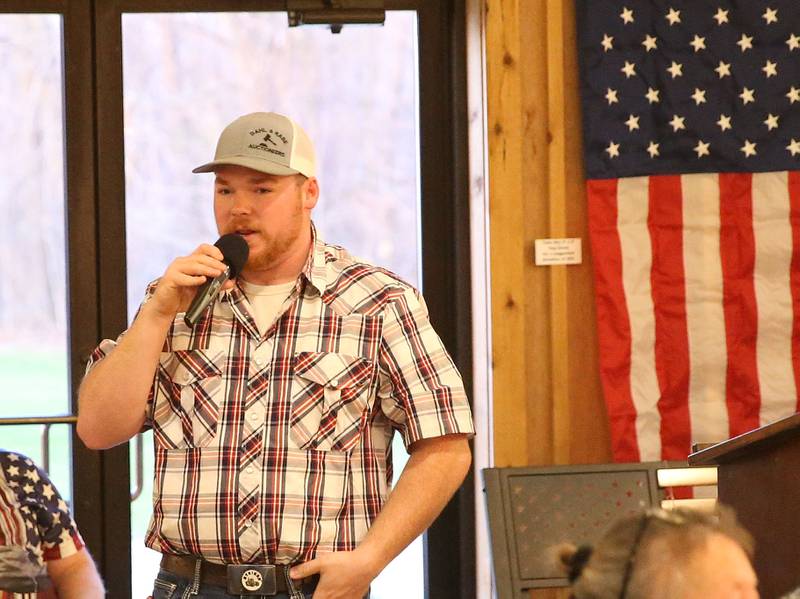 Auctioneer Collin Rabe facilitates the bidding and sales of items during the Flags of Freedom 1-80 Star Spangled 20 Year Anniversary celebration on Saturday, April 5, 2025 at the Hundred Acre Orchard in Princeton.