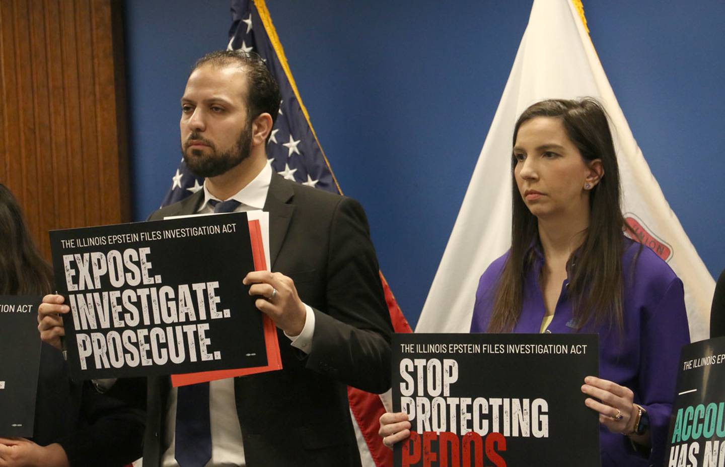 State Rep. Abdelnasser Rashid and state Rep. Anne Stava hold signs promoting the Illinois Epstein Files Investigation Act at a news conference on Monday, March 2, 2026, in downtown Chicago.