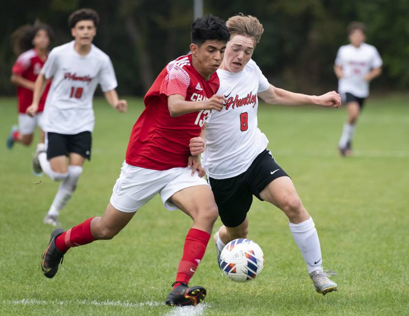 Dundee-Crown's Christian Lechuga and Huntley's Gavin Eagan chase a loose ball during their game on Thursday, October 6, 2022 at Dundee-Crown High School in Carpentersville. Dundee-Crown won 1-0.