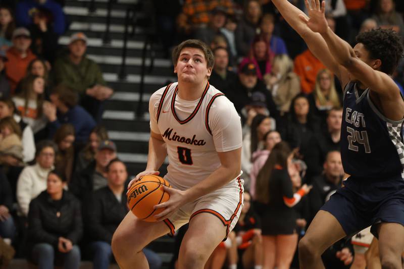 Minooka’s Jackson Miranda works under the basket against Oswego East on Friday, Jan. 16, 2026 in Minooka.