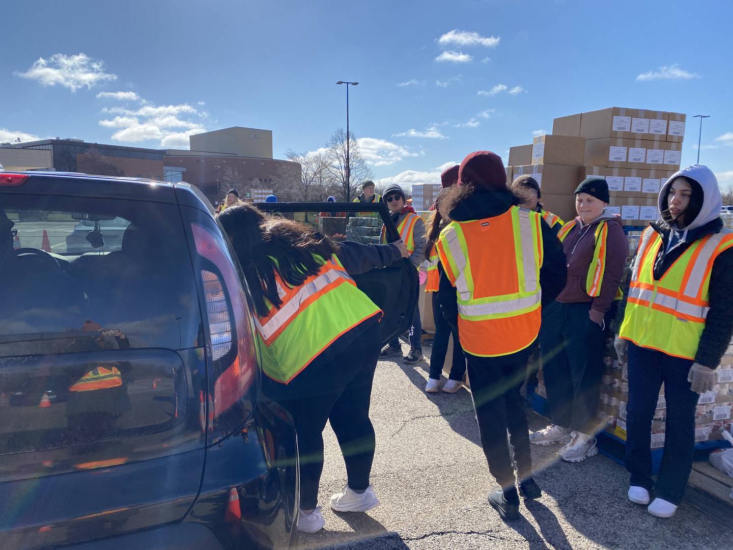 Volunteers oack boxes to be distributed to area food pantries from Northern Illinois Food Bank. The bank expects to service thousands this holiday season, noting the need to address food insecurity is higher than numbers recorded during the COVID-19 pandemic.