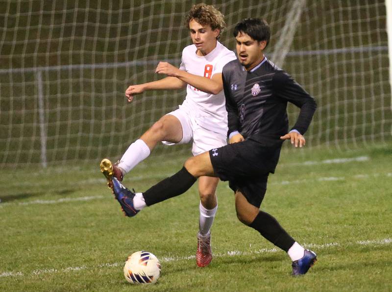 Ottawa's Jaickob Pastor Ortiz and Kankakee's Joseph Andrade race to the ball during the Class 2A Regional semifinal game on Monday, Oct. 20, 2025 at Ottawa HIgh School.