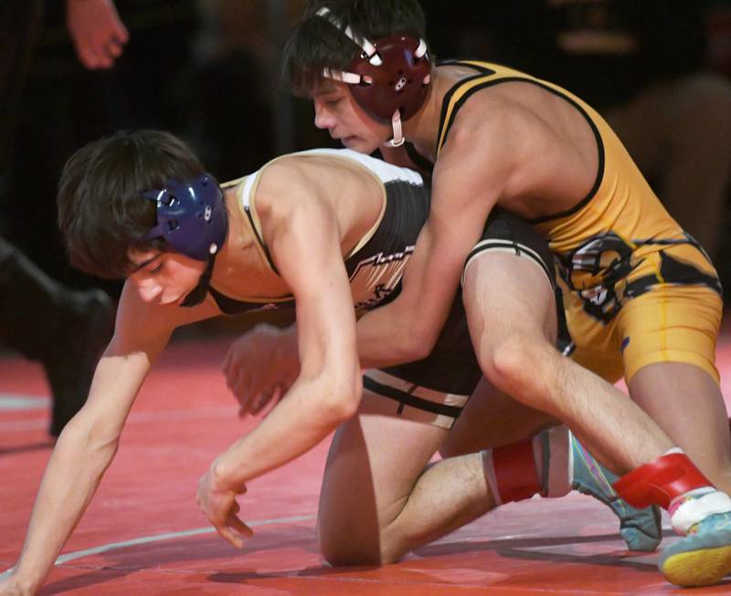 Polo's Josiah Perez (bottom) tries to break free from Riverdale's Dean Wainwright as they wrestle for the championship at 106 pounds at the 1A Oregon Wrestling Sectional on Saturday. Wainwright won the match. Both advance to the state finals next week.