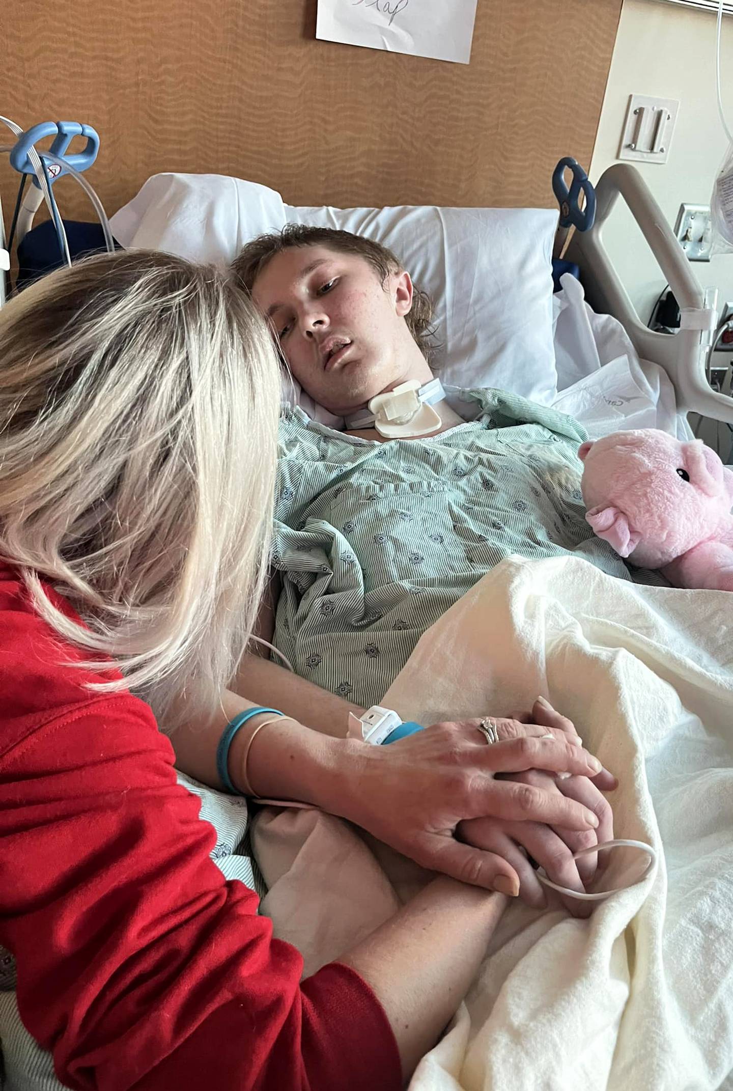 Jennifer Outerbridge holds hands with her son, Caleb, 17,  in a photo she posted March 6, 2025.