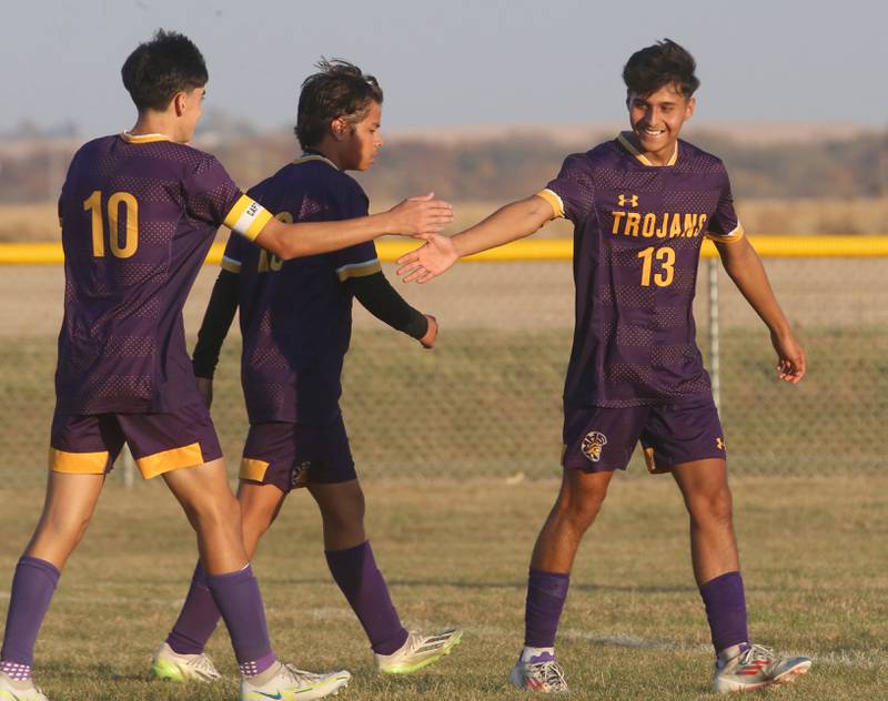 Mendota's Johan Cortez hi-fives teammate Sebastain Carlos after scoring a goal against Princeton during the Class 1A Regional final game on Tuesday, Oct. 22, 2024 at Serena High School.