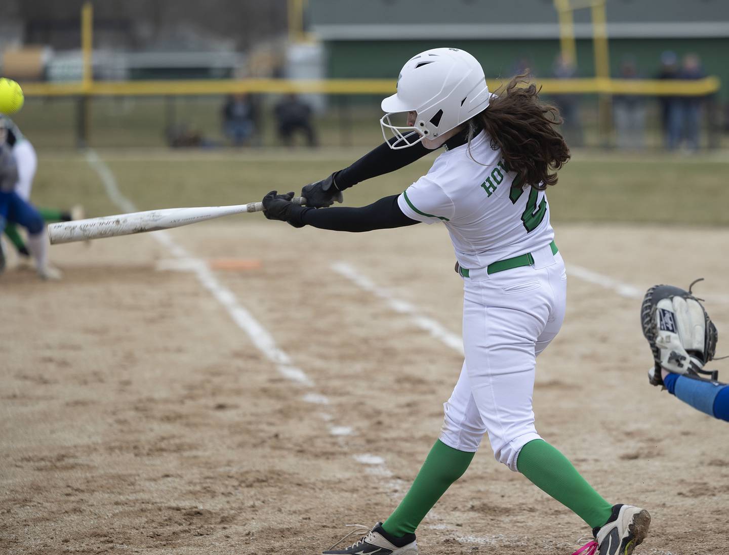 Rock Falls’ Brooke Howard hammers a ball to deep right to drive in two against Princeton Thursday, March 23, 2023.