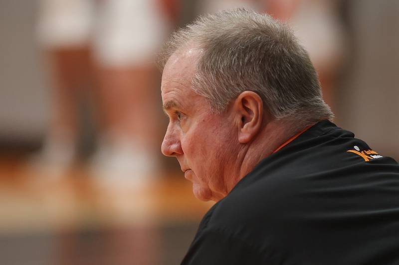 Minooka head coach John Placher sits on the bench during game against Moline in the Class 4A Minooka Regional championship game on Thursday, Feb. 19, 2026 in Minooka.