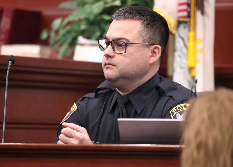 DeKalb police officer Charles Verdone testifies Wednesday, Feb. 18, 2026, during Hamza Khatatbeh’s murder trial at the DeKalb County Courthouse in Sycamore. Khatatbeh is accused of fatally stabbing Sycamore 17-year-old Kaleb McCall in 2023.