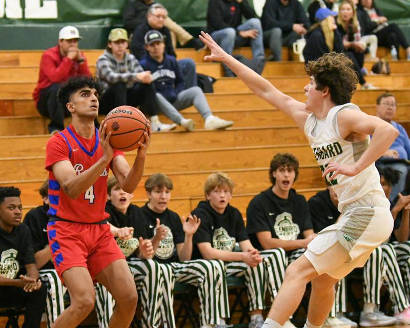 Glenbard South's Masroor Sahi (4) takes a shot while being defended by Glenbard West's Bennett Schwnanke (22) on Monday Nov. 20, 2023, district 87 Invite held at Glenbard West.