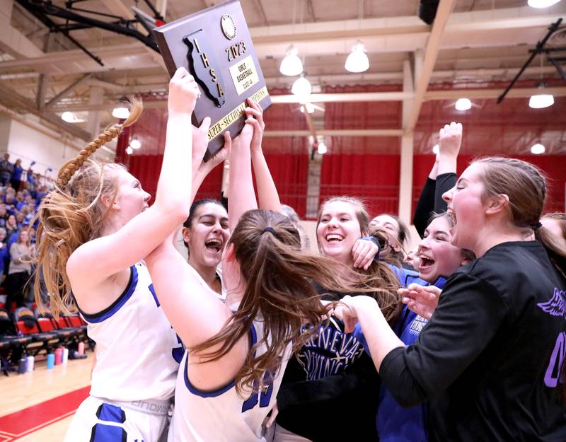 Geneva players celebrate their Class 4A Schaumburg Super-Sectional win over Barrington on Monday, Feb. 27, 2023.