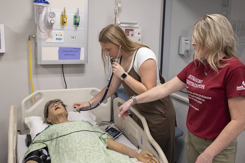 Korah Hosler of Rock Falls High School learns how to listen for a heartbeat on a mannequin Friday, April 17, 2026, while touring SVCC’s health care programs.