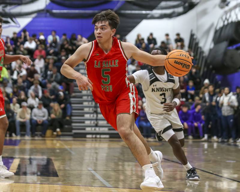 La Salle-Peru's Erick Sotelo (5) drives to the basket during the Plano Christmas Classic semifinals Monday, Dec 29, 2025, in Plano.