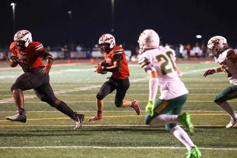 Bradley-Bourbonnais' Isaac Allison runs the ball behind teammate Tyrell Berry, left, during the Boilermakers' 35-6 victory over Waubonsie Valley Friday, Sept. 12, 2025. Allison would score a touchdown on the next play.