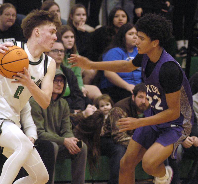 Rock Fall's Max Burns runs into Dixon's Xavion Jones. The Rock Falls Rockets hosted the Dixon Dukes in a Conference basketball game. The game was held at Forest Tabor gym in Rock Falls on Friday, February 13, 2026