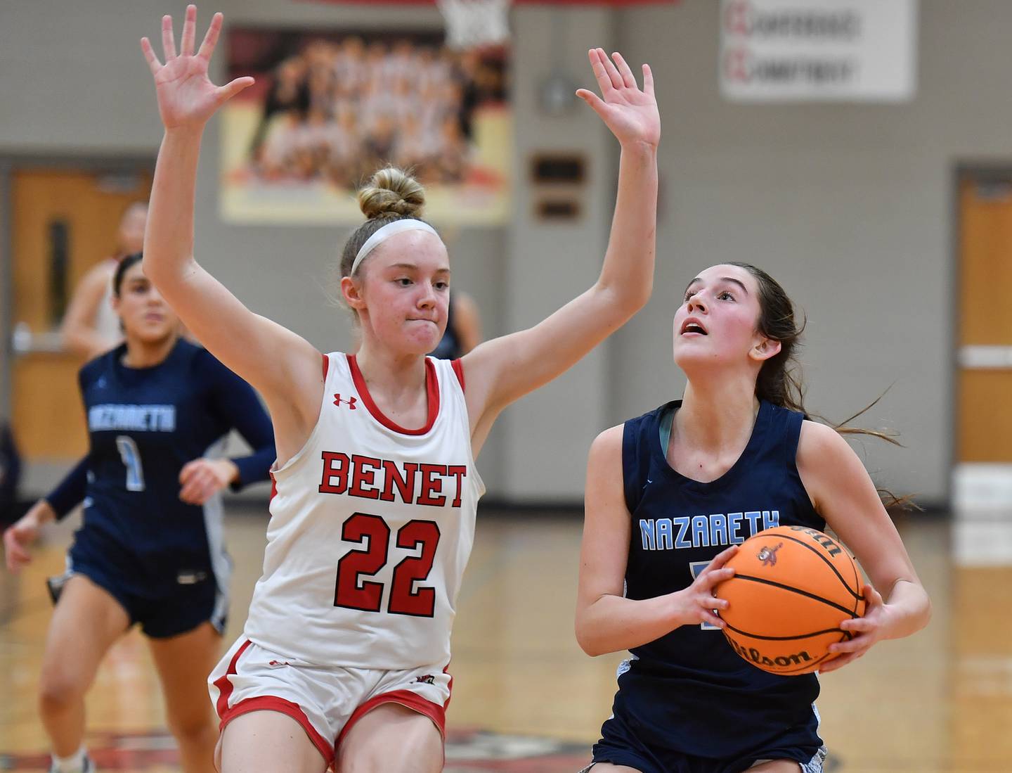 Nazareth’s Sophia Towne goes to the basket as Benet’s Bridget Rifenburg (22) defends during a game on January 29, 2025 at Benet Academy in Lisle.
