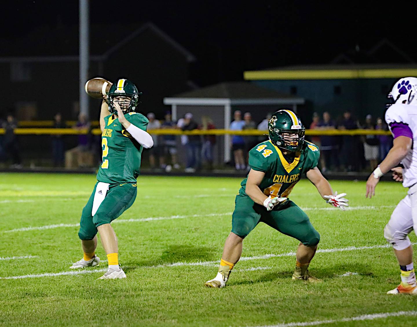 Coal City's Braden Reilly looks for a receiver Friday in a 10-7 loss to Wilmington. Reilly completed 12 of 23 passes for 74 yards.