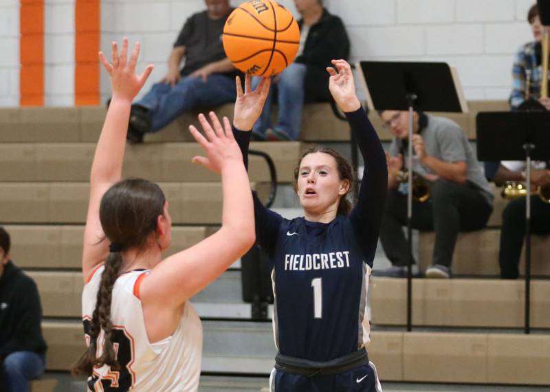 Fieldcrest's Kaitlyn Palm shoots a shot over Flanagan-Cornell/Woodland's Chandler Weber during the Falcon-Irish Thanksgiving Tournament on Monday, Nov. 18, 2024 at Flanagan High School.