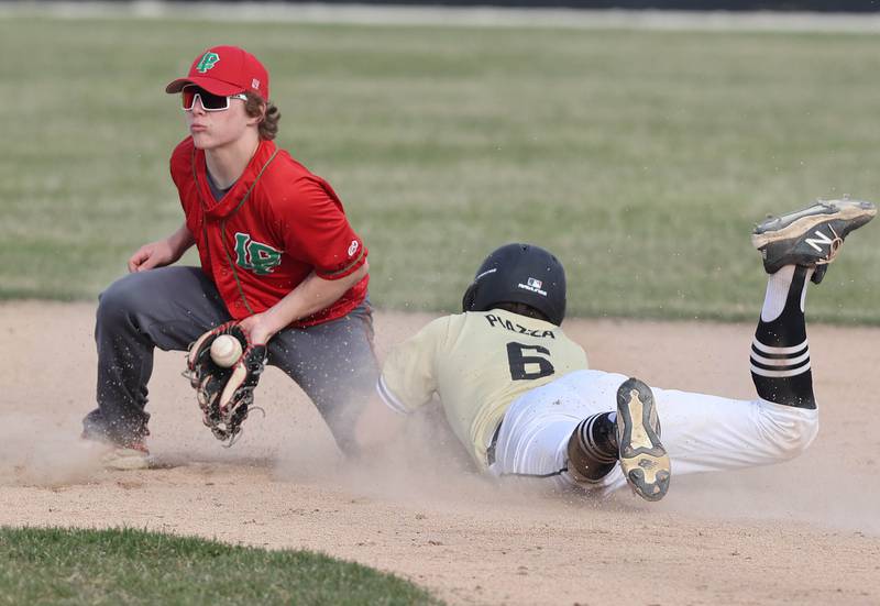 Sycamore's Owen Piazza slides safely into second with a stolen base as LaSalle-Peru's Mason Lynch takes the throw during their game Monday, April 11, 2022, at the Sycamore Community Sports Complex.