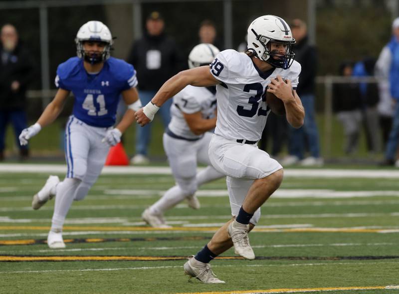 Cary-Grove's Holden Boone runs fo a touchdown during an IHSA Class 6A semifinal football game against Geneva on Saturday, Nov. 23, 2024, at Geneva High School.