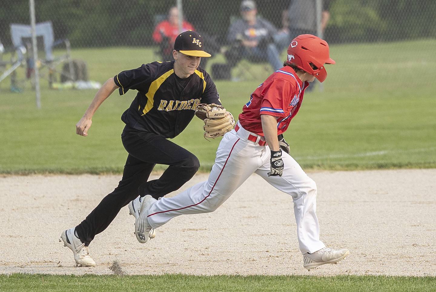 AFC’s Carson Rueff tracks down and tags out Morrison’s Jake Reed Wednesday, May 17, 2023.